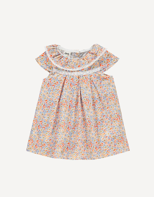 Designed with practicality and elegance in mind, the back button fastenings ensure effortless dressing, allowing you to spend less time fussing and more time enjoying the sunshine. The playful frilled short sleeves add a touch of whimsy and charm, perfect for embracing the carefree spirit of summer.