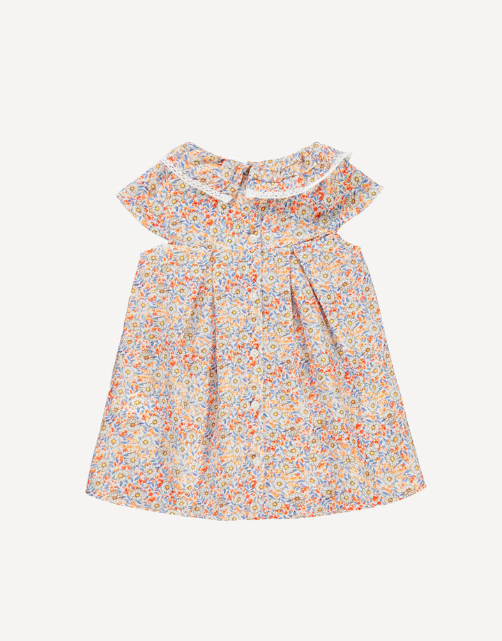 Designed with practicality and elegance in mind, the back button fastenings ensure effortless dressing, allowing you to spend less time fussing and more time enjoying the sunshine. The playful frilled short sleeves add a touch of whimsy and charm, perfect for embracing the carefree spirit of summer.