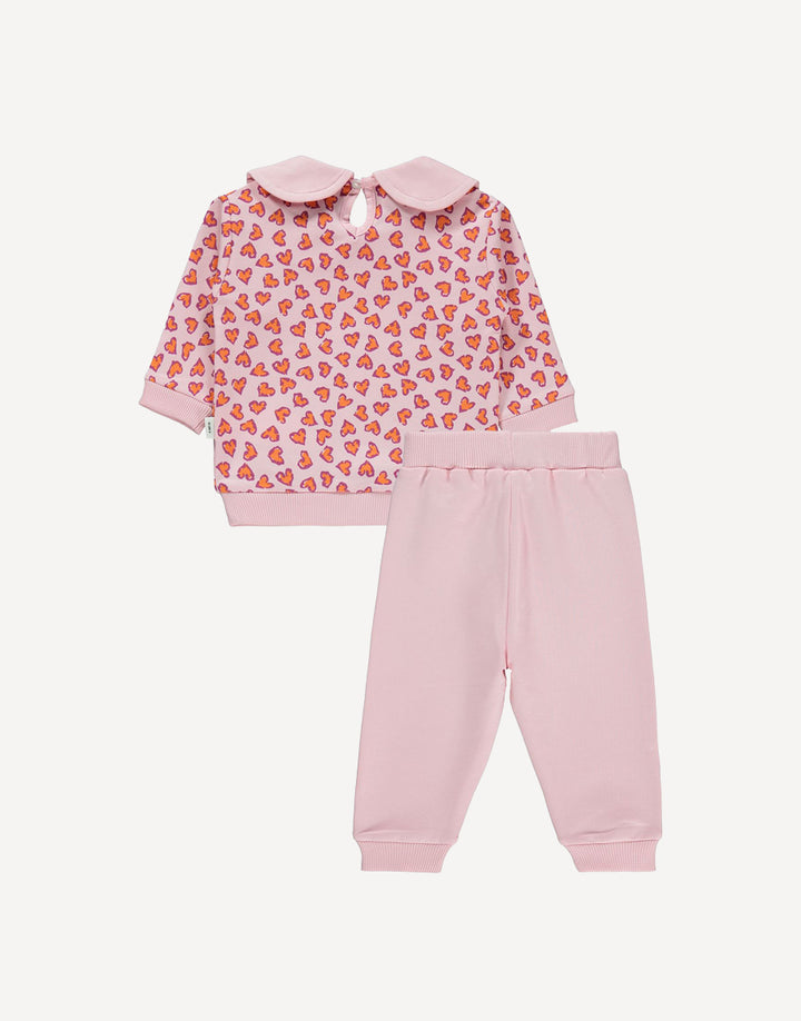 The set includes a long-sleeved top featuring a delightful hearts print design, adding a touch of charm to your child's wardrobe. Complete with a classic Peter Pan collar detail, this top exudes sweetness and sophistication.
